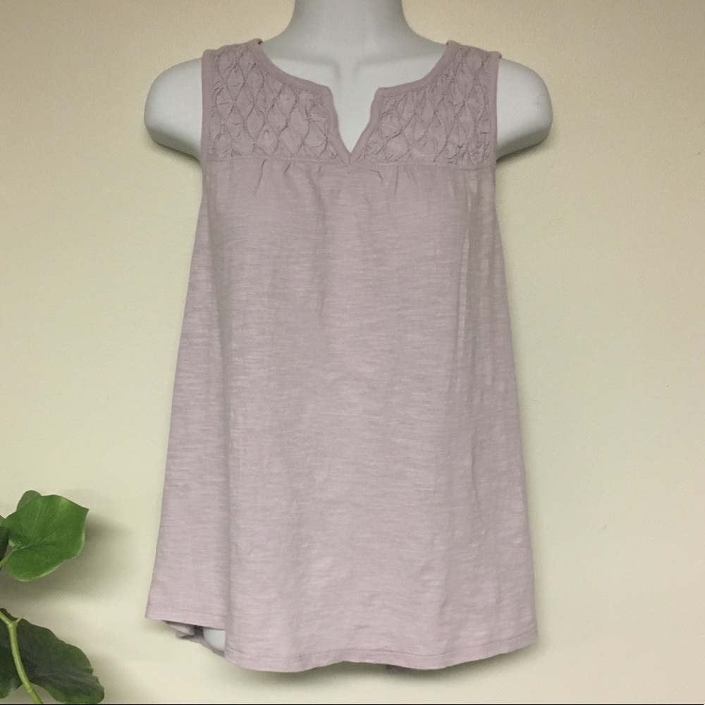 Sleeveless lilac top with flyaway back